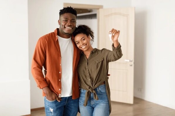 Young black couple having purchased their first house