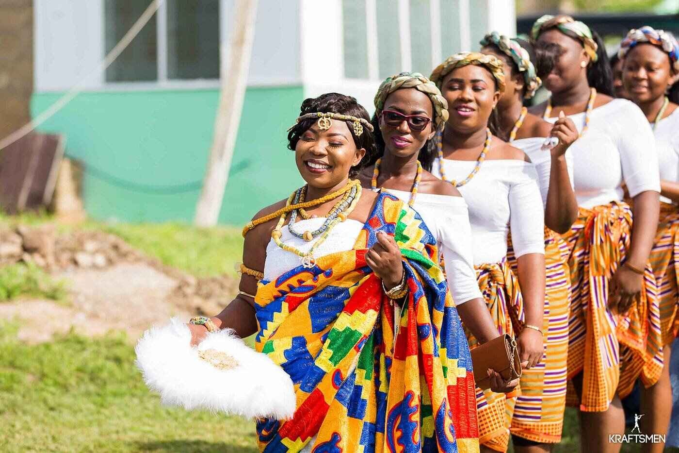 A procession of african ladies accompanying a maiden to her husband-to-be